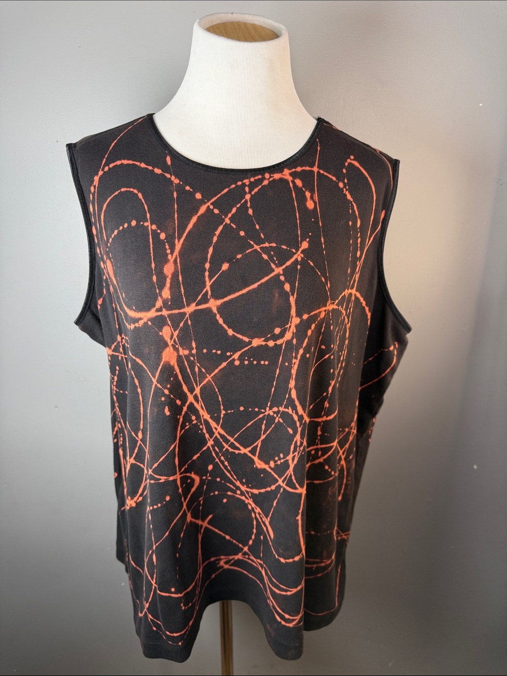 Sleeveless Black Top with Orange Abstract Print